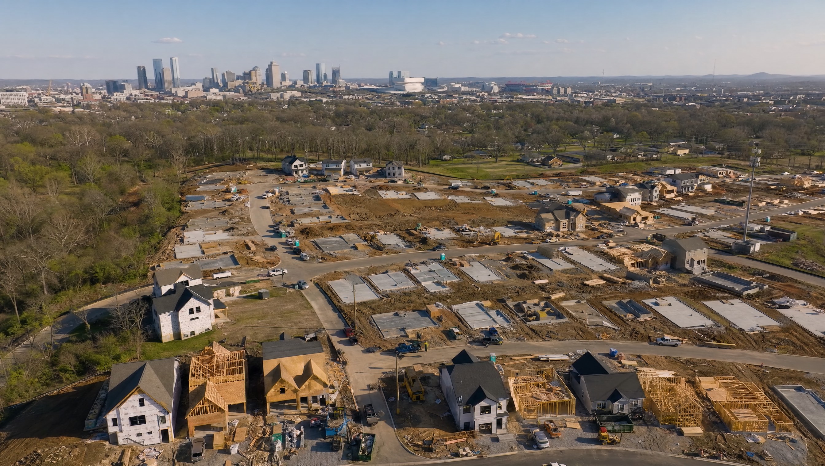 Aerial view of Nashville new construction subdivision with Nashville skyline in background